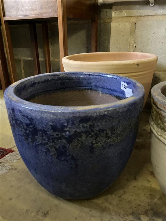 Seven glazed earthenware and terracotta garden pots, largest 37cm diameter